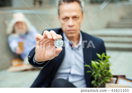 Skillful smart office manager putting token out of pocket Skillful smart office manager putting token out of pocket 41621103