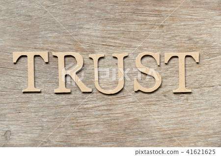 Alphabet letter in word trust on wood background Alphabet letter in word trust on wood background 41621625