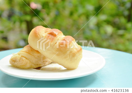 bread stuffed pork sausage on white dish 41623136