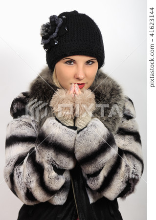 portrait of girl in warm hat and fur coat portrait of girl in warm hat and fur coat 41623144