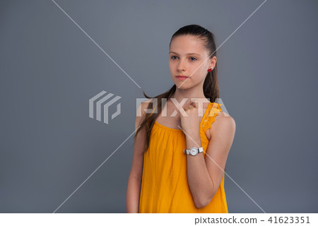 Sweet teenage girl pondering over something 41623351