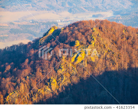 Frydlatske cimburi granite rock formation on the ridge in the middle of beech forest of Jizera 41623354