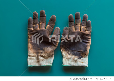 Glove with oil stain on isolated background. Glove with oil stain on isolated background. 41623822
