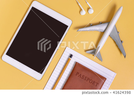 Travel flat lay yellow background travel concept Travel flat lay yellow background travel concept 41624398