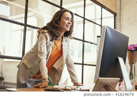 Jovial pregnant CEO having online meeting Jovial pregnant CEO having online meeting 41624679