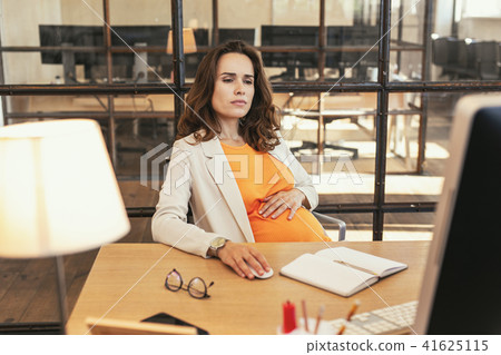 Earnest pregnant CEO checking project 41625115