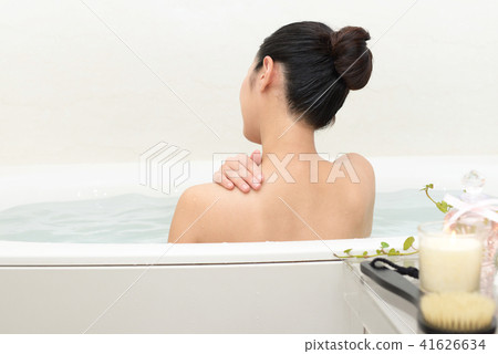 A woman relaxing in the bathroom A woman relaxing in the bathroom 41626634