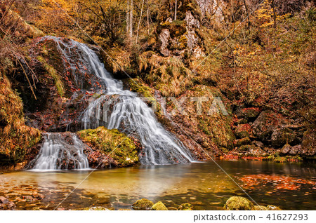 Beautiful waterfall in forest, autumn scene. Beautiful waterfall in forest, autumn scene. 41627293