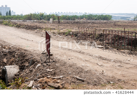 Dirt road to the construction site. Dirt road to the construction site. 41628444