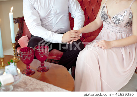 Close-up happy young couple have a date in luxury apartment Close-up happy young couple have a date in luxury apartment 41629380