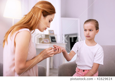 Nice cheerless girl giving her hand Nice cheerless girl giving her hand 41629614