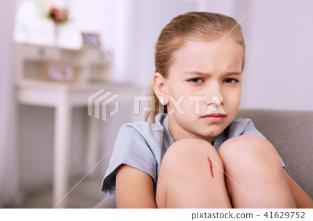 Cheerless gloomy girl looking at you Cheerless gloomy girl looking at you 41629752