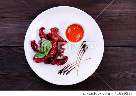 Roasted sausages with tomato sauce Roasted sausages with tomato sauce 41629855
