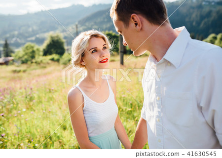 Couple in love walking in the mountains, having fun Couple in love walking in the mountains, having fun 41630545