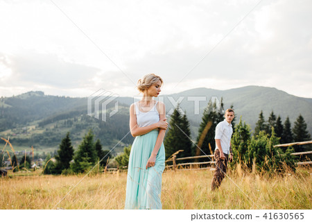 Couple in love walking in the mountains, having fun Couple in love walking in the mountains, having fun 41630565