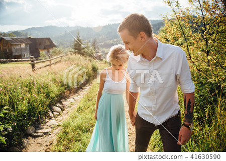 Couple in love walking in the mountains, having fun Couple in love walking in the mountains, having fun 41630590