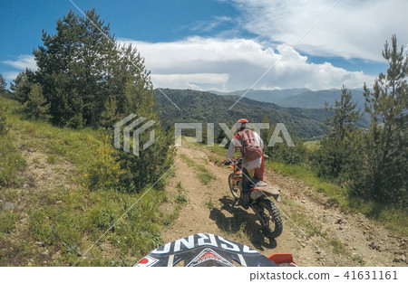 Extreme Adventure traveller with the dirt bike Enduro in high Caucasus mountains 41631161