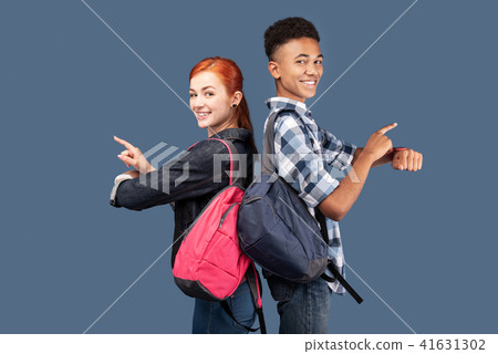 Happy joyful people pointing at their smartwatches 41631302