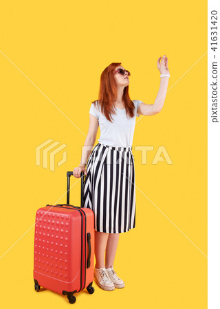 Nice young woman standing in front of the door 41631420
