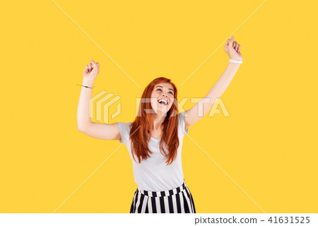 Delighted joyful woman showing her happiness Delighted joyful woman showing her happiness 41631525