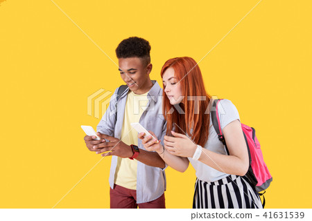 Positive nice couple using their gadgets 41631539