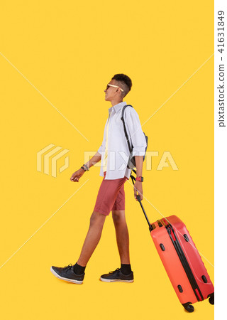 Happy nice man walking with a suitcase 41631849