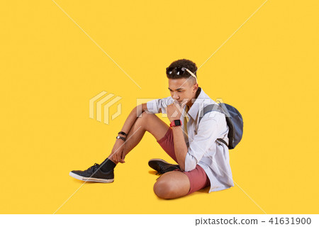 Pleasant thoughtful man holding his chin 41631900