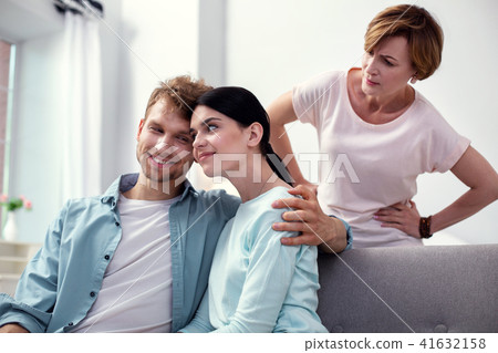 Pleasant happy man hugging his wife 41632158