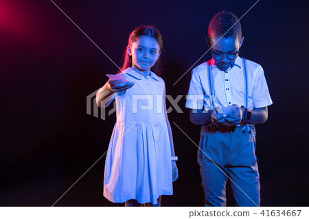 Alert girl holding her modern phone 41634667