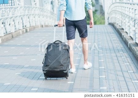Young man traveling carry case 41635151