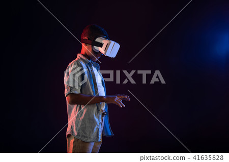 Happy boy wearing a modern VR headset 41635828