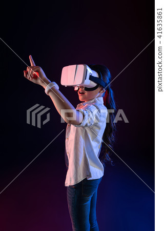 Amazed schoolgirl wearing a VR headset 41635861