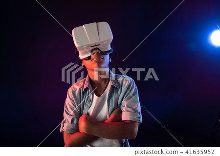 Meditative schoolboy wearing a modern VR headset Meditative schoolboy wearing a modern VR headset 41635952