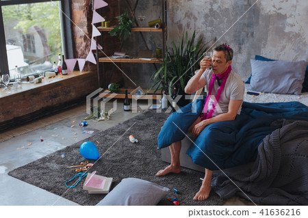 Weary mature man rejoicing birthday Weary mature man rejoicing birthday 41636216