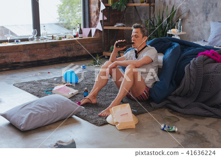 Tired mature man drinking alcohol Tired mature man drinking alcohol 41636224