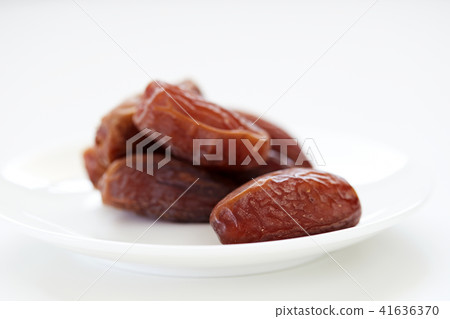 Dried Dates Fruits on dish white background Dried Dates Fruits on dish white background 41636370