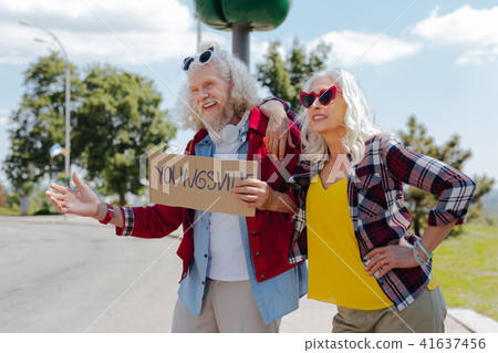Delighted positive couple travelling Delighted positive couple travelling 41637456