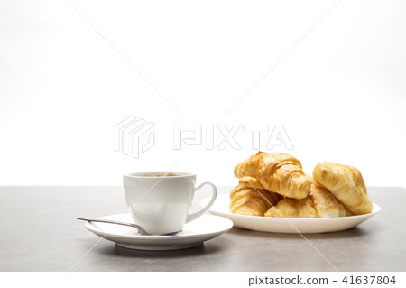 Cup of fresh coffee with croissants Cup of fresh coffee with croissants 41637804