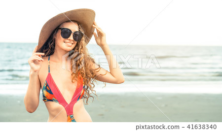 Happy young woman at beach in summer vacation. 41638340