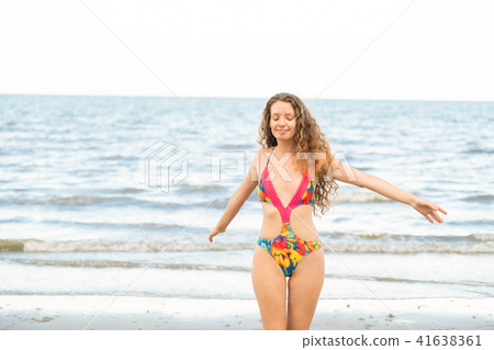 Happy young woman at beach in summer vacation. 41638361