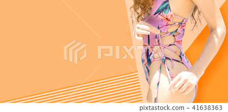 Woman in swimsuit posing on color background. 41638363