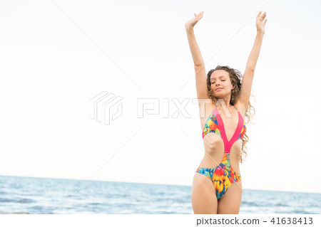 Happy young woman at beach in summer vacation. Happy young woman at beach in summer vacation. 41638413