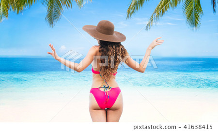 Happy young woman at beach in summer vacation. Happy young woman at beach in summer vacation. 41638415
