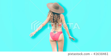 Woman in swimsuit posing on color background. Woman in swimsuit posing on color background. 41638461