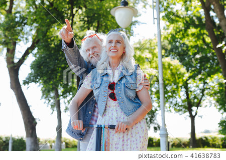 Happy bearded man standing behind his wife Happy bearded man standing behind his wife 41638783