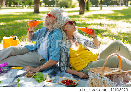 Happy nice couple enjoying their drinks Happy nice couple enjoying their drinks 41638973