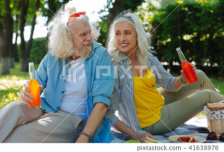 Happy joyful couple having a picnic Happy joyful couple having a picnic 41638976