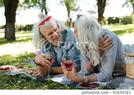 Delighted nice couple having a conversation Delighted nice couple having a conversation 41639161