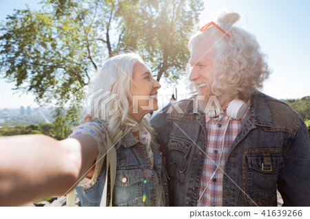 Joyful positive couple looking at each other Joyful positive couple looking at each other 41639266
