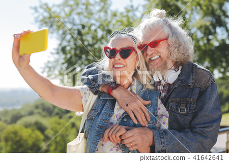 Delighted nice woman smiling Delighted nice woman smiling 41642641